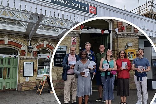 Facade of Lewes railway station with inset picture of several LibDems holding petition forms