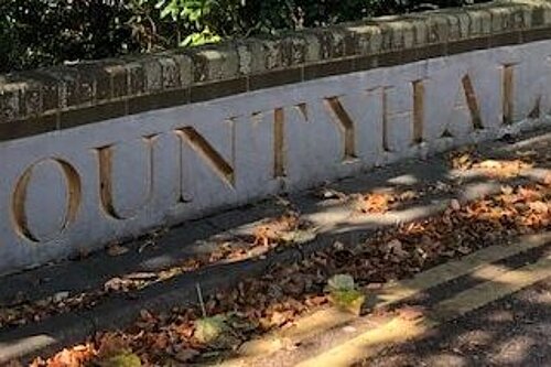 Imposing gold lettering on stone outside East Sussex County Council offices, reads "County Hall2.
