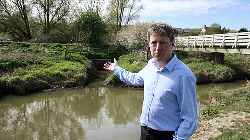 On a fine day James points rather disconsolately towards the brown waters of the Cuckmere
