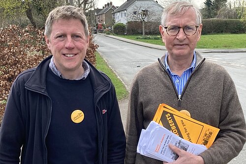 James MacCleary and Daniel Stewart-Roberts with a rural street in the background