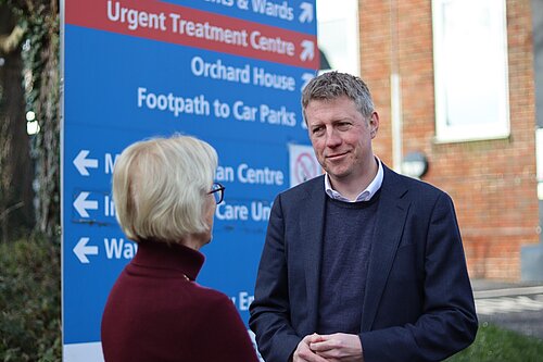 James MacCleary outside the Victoria Hospital, talking to a constituent