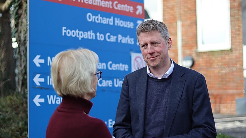 James MacCleary outside the Victoria Hospital, talking to a constituent