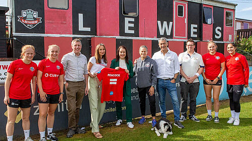 James with sports minister Stephanie Peacock and representatives of lewes FC women's team.