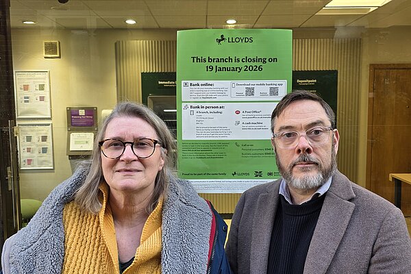 Edwina Livesey and Kevin West stand outside the Lloyds Bank Branch on Cliffe High Street Lewes. The branch is due to close in January 2026.