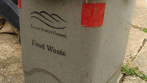 A Lewes District Council food waste bin that has clearly been well used.