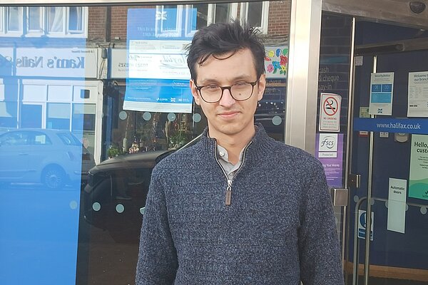 Cllr Freddie Hoareau outside the Halifax Bank branch in Seaford that is due to close.